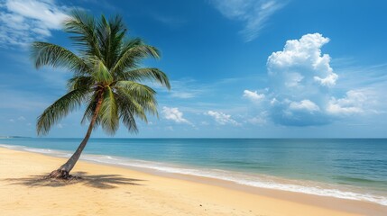 Naklejka premium A single palm tree sways gently on a sandy beach under a clear blue sky with fluffy white clouds. The calm, turquoise ocean stretches out to the horizon, creating a serene tropical paradise.