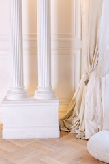 Elegant white interior design with classic columns and luxurious drapes