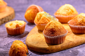 Homemade Muffins on a Wooden Cutting Board