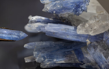 Detailed macro shot of blue kyanite crystal formation, showcasing sharp edges and natural...