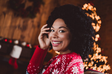 Photo of lovely cheerful girl look camera dreamy dressed red christmas garment tradition atmosphere decor vibe house indoors room