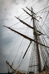 Fototapeta premium Majestic Tall Ship Masts Against a Cloudy Sky