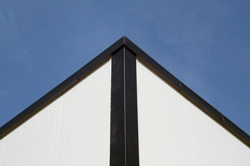 Metal modern warehouse against blue sky