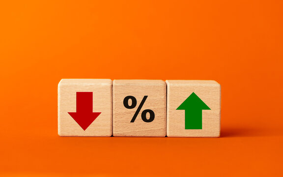 business concept. Economic and financial analysis, interest rates, stocks, bonds, ranking, mortgage, loan rates, Percent, up or down, arrow symbol. beautiful orange background, copy space
