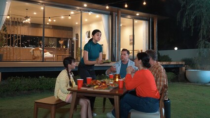 Family gather celebrate holiday. Parents, grandparents and girl together to talk and have dinner party food. Outdoor activity for spending time with multigeneration cross generation gap. Divergence.