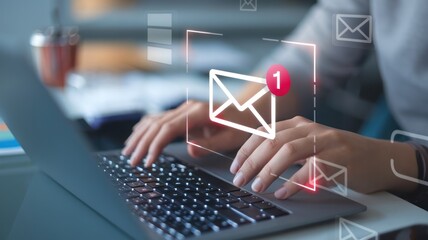 Close-up of hands typing on a laptop keyboard with a notification of a new email. Ideal for illustrating communication and technology in the modern workplace.