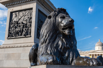 Trafalgar Square , London, UK: Landseer Lions and Tall stone pillar of Nelson's Column