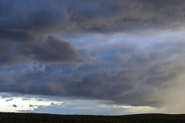 Obraz premium Dramatic sky over the fields. Agricultural landscape in eastern Lithuania.