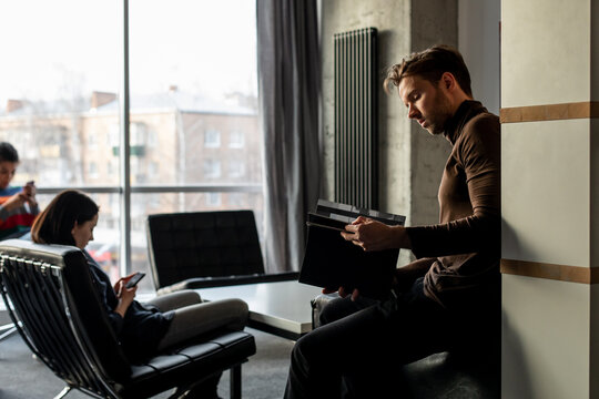Break from work in office, group of people chatting in office