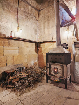 Wood pile next to wood fire