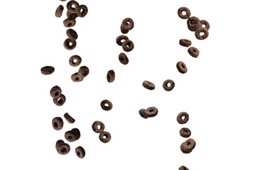 Chocolate rings cereal spill out into a bowl. Breakfast.