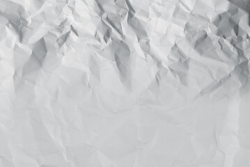 Crumpled white paper background.