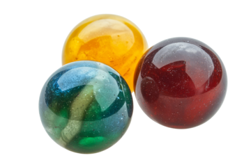 Three glass marbles with shiny surface in different colors. Transparent background