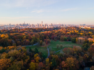Aerial landscape of Prospect Park lake and Brooklyn Manhattan Skylines during fall in New York City