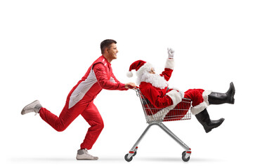 Car racer running and pushing a Santa claus inside a shopping cart