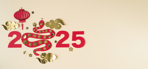 Chinese new year, year of the snake, year 2025 with snake in red and gold colors.