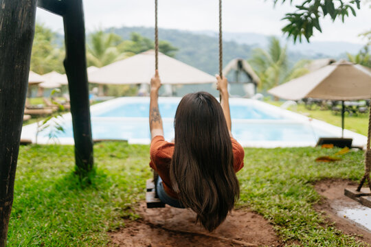 Relaxing Swing by Tropical Pool