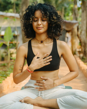 Woman Smiling with Closed Eyes While Doing Yoga Pranayama