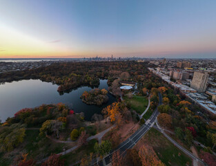 Aerial landscape of Prospect Park lake and Brooklyn Manhattan Skylines during fall in New York City