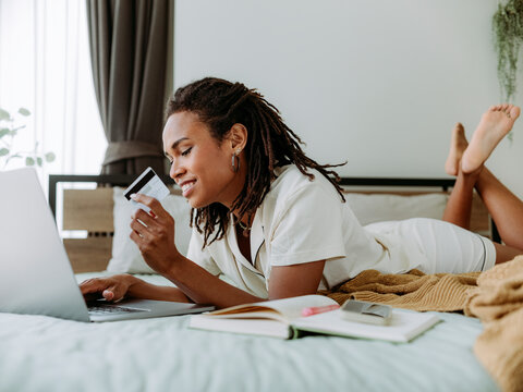 Young Black Woman Shopping Online from Home