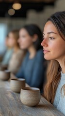 Participants at a tea degustation event, thoughtfully sipping tea from small cups, exploring flavors and textures 