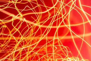 Yellow and orange light streaks with red background
