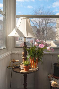 Cosy corner with flowers and natural sunlight from the window