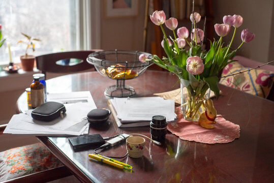 Electronics , medicine and stuff on dining table