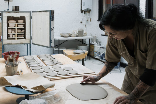 Ceramist creating handmade clayware in workshop