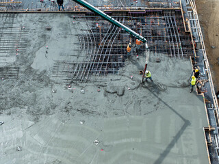 Pouring a concrete slab with an industrial pump © vin