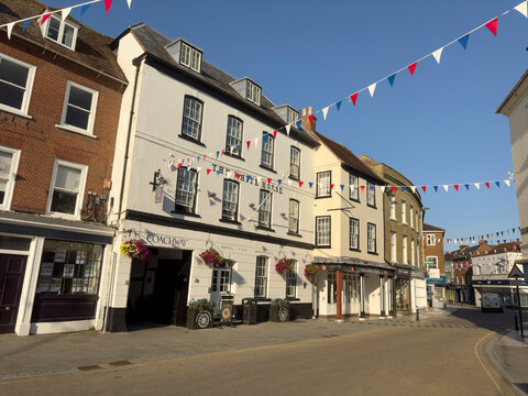 Romsey Hampshire England  29.07. 2024.  Romsey town centre  historic buildings on a summer evening. UK