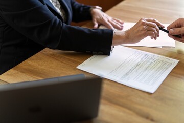 Handing Over a Pen for Signing Documents
