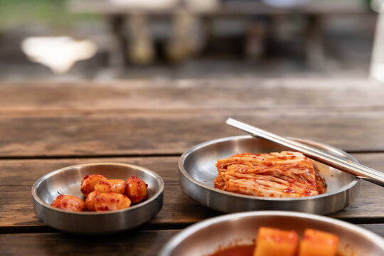 Closeup of picked vegetables served on metal plates at a restaurant in Seoul, Korea. 