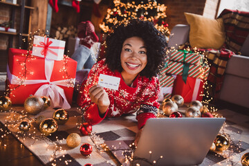 Full body photo of nice young girl eshopping netbook credit card wear red christmas clothes x-mas party decoration interior flat indoors