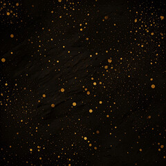 Abstract black background with golden speckles and splatters