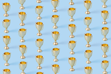 Seamless pattern of golden cups standing in horizontal rows