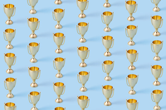 Seamless pattern of golden cups standing in horizontal rows