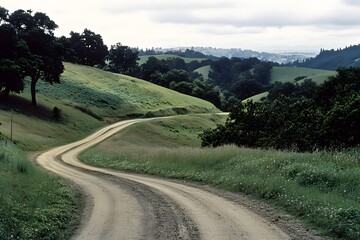 Winding dirt road through hills