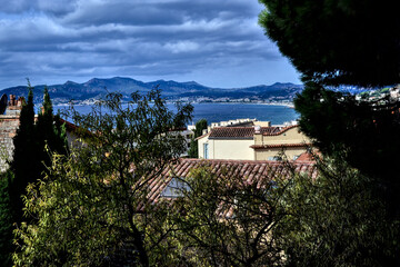 Cannes, France - September 7th 2024 : Beautiful cityscape of Cannes from the castle, with a point of view on the sea. You can also see mountains.