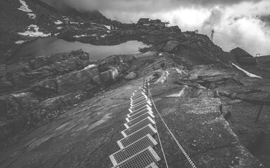 Stairway by rocky mountain in high Alps