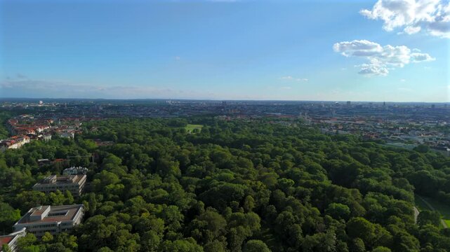 Aerial view of English Garden in Germany, Munich and Monopteros. Lookout point and round temple in English Garden. Chinesischen Turm top view in summer. Luftaufnahme des Englischen Gartens. 