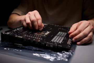 Hands Engaged in the Process of Working on Computer Hardware Installation and Upgrading