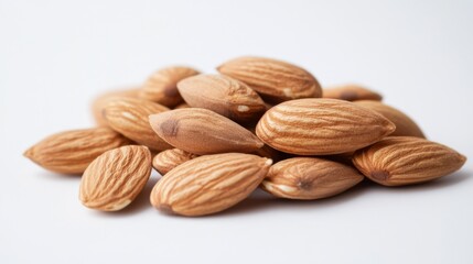 Raw Almonds Piled on White Background