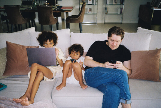 Father with kids with gadgets