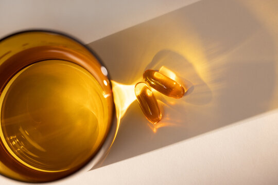 Overhead View of Glass with Fish Oil Gel Capsules