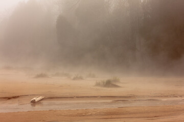 Fog comes in off Lake Michigan onto the beach at Harrington Beach State Park, Belgium, Wisconsin in...