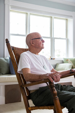 Senior military man Veteran at home alone  in rocking chair 