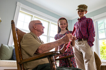 Young Girl hands card portrait thanking veteran tribute with brother 