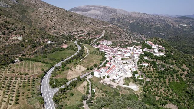 Mountain village offers scenic view with winding roads, olive groves, in tranquil environment, Atajate, Malaga, Andalucia, Spain