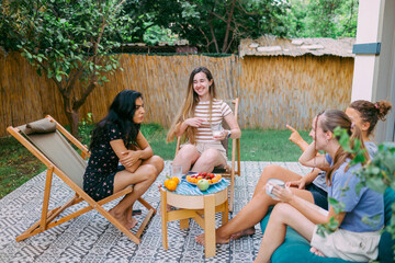 Best friends meeting at home to have dinner party at the backyard